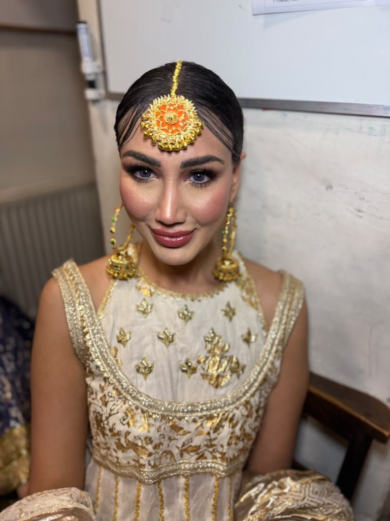 Bridal tikka earrings gold outfit closeup