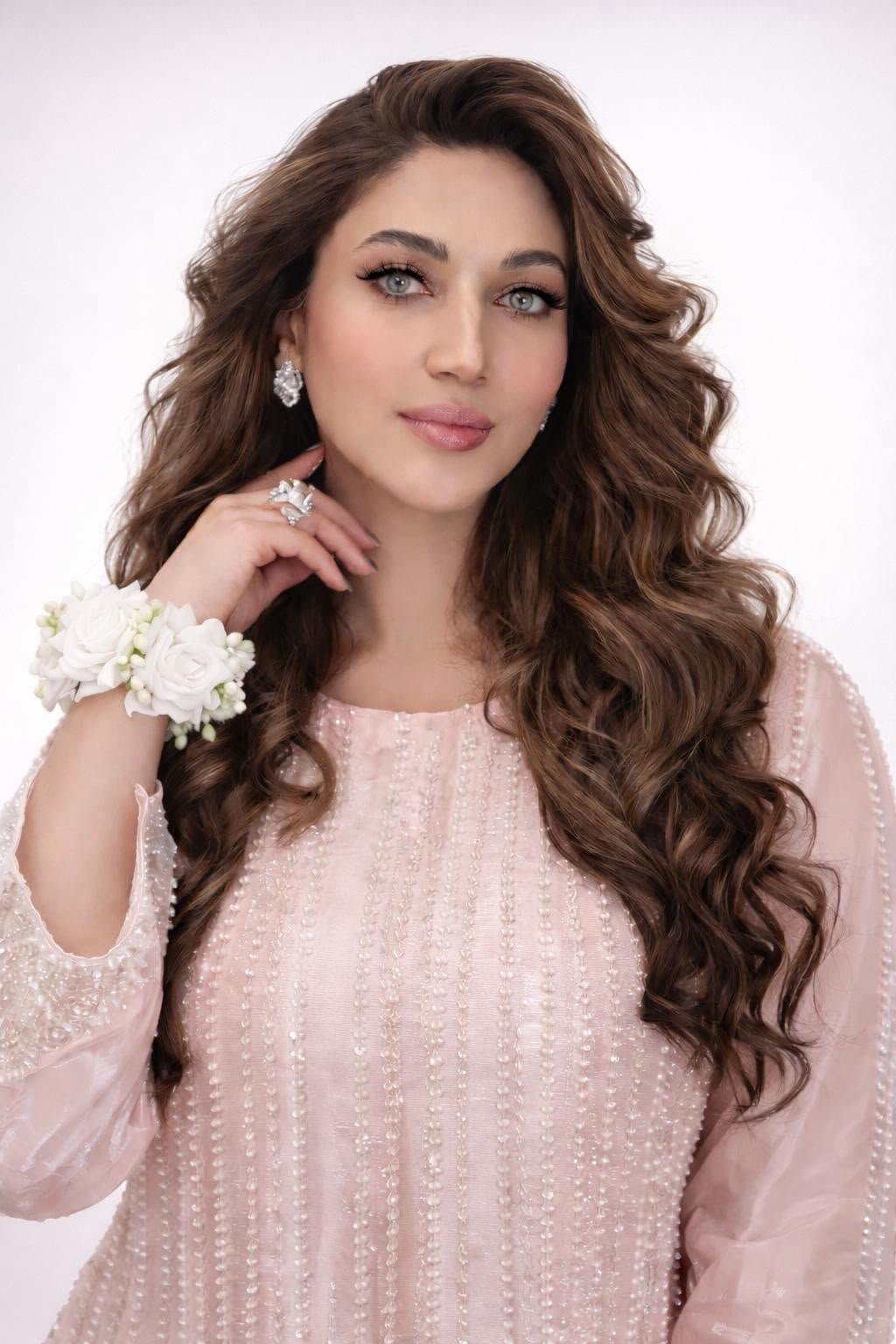 Curled hair pink outfit floral corsage