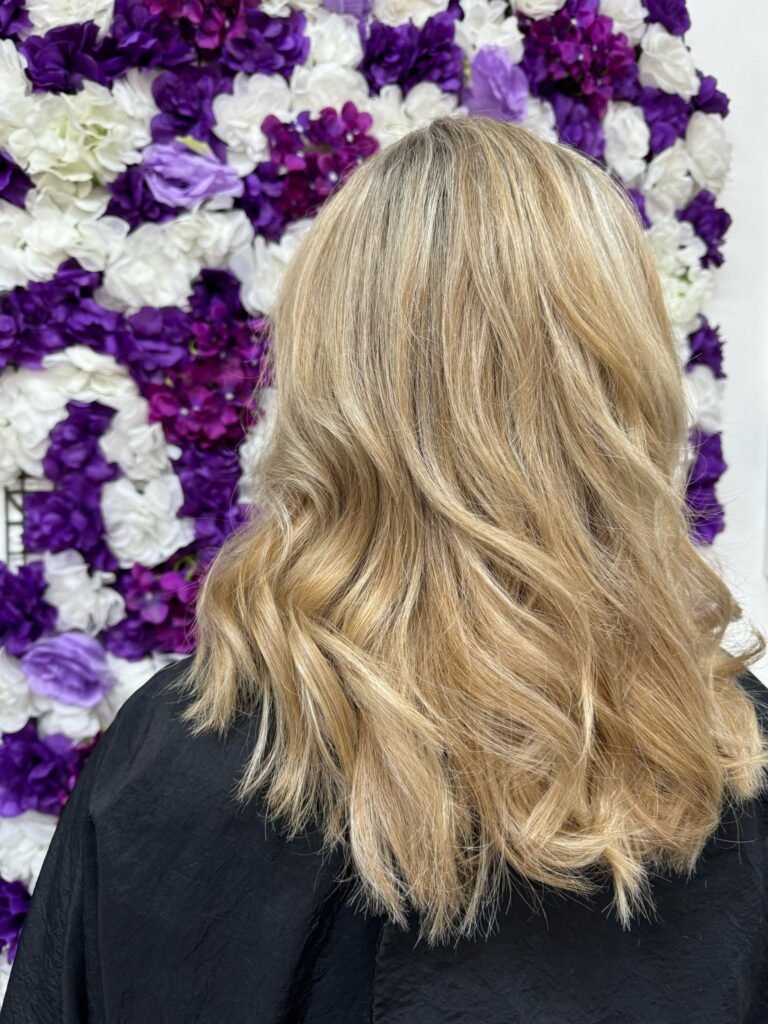 Blonde Balayage Curls Flower Wall